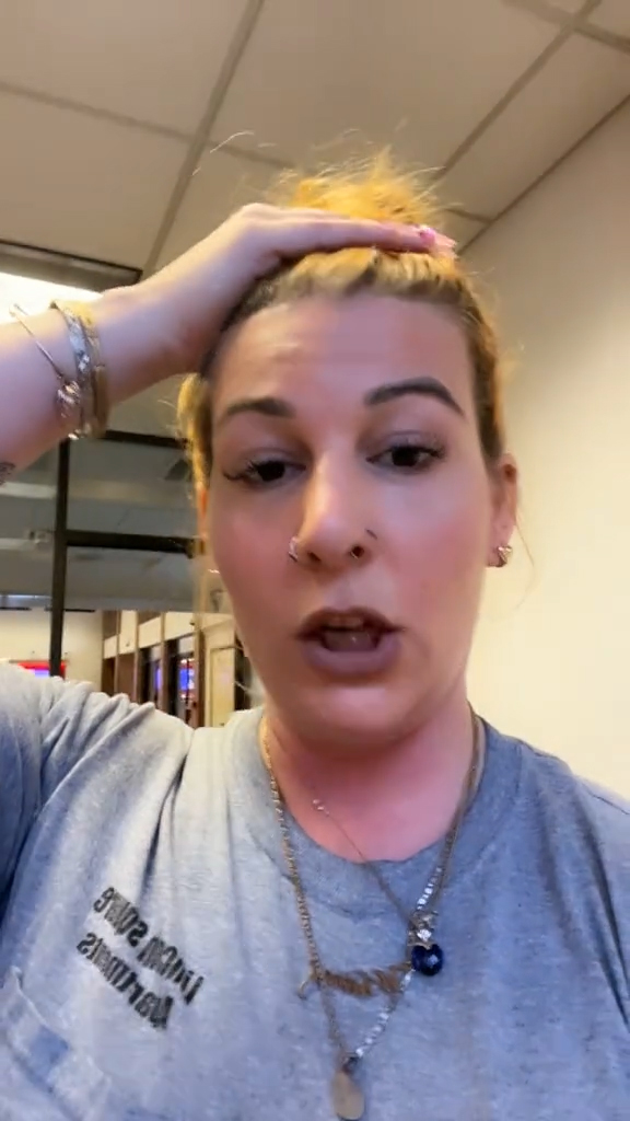 A woman cleaning up at a bank