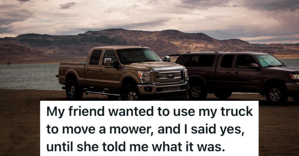 Two trucks by a lake