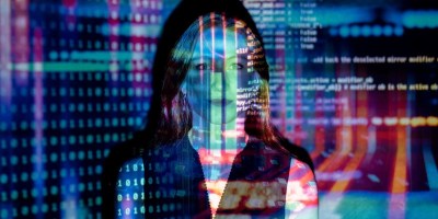 A woman overlaid with computer code