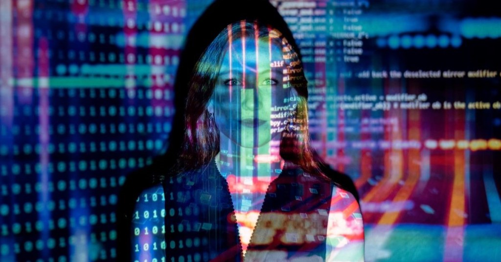 A woman overlaid with computer code