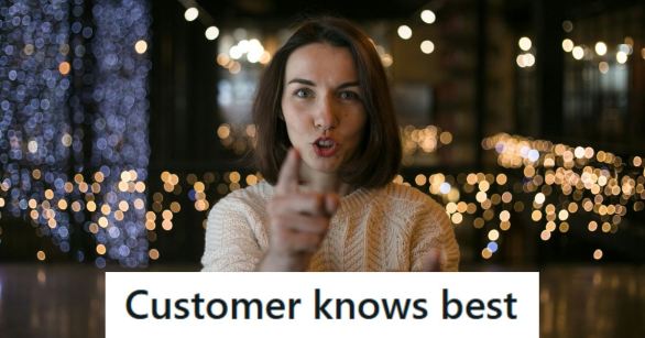 Woman who is pointing and yelling at a customer service agent