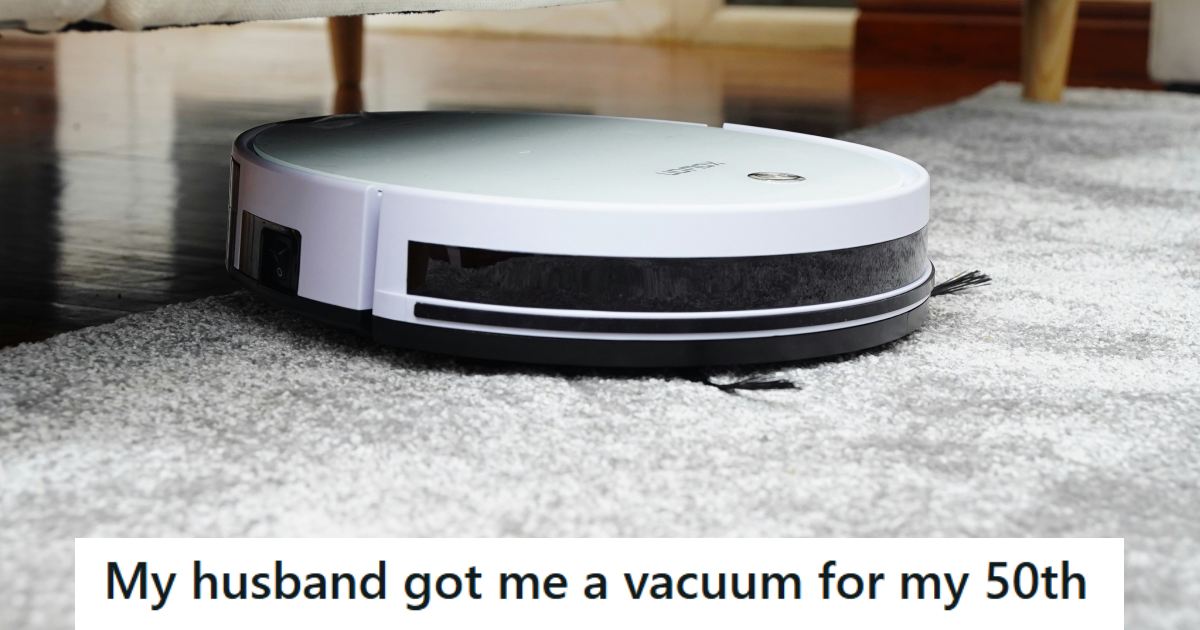 Robot vacuum cleaner working on a rug under the couch