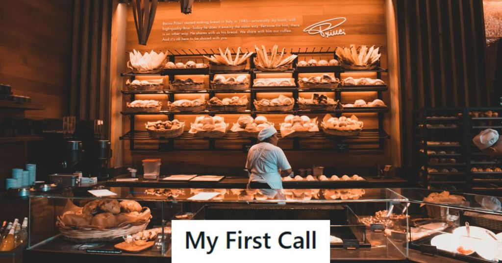 Bakery manager organizing baked goods on back wall