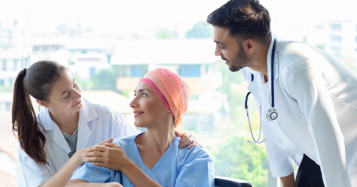 Cancer patient with doctors