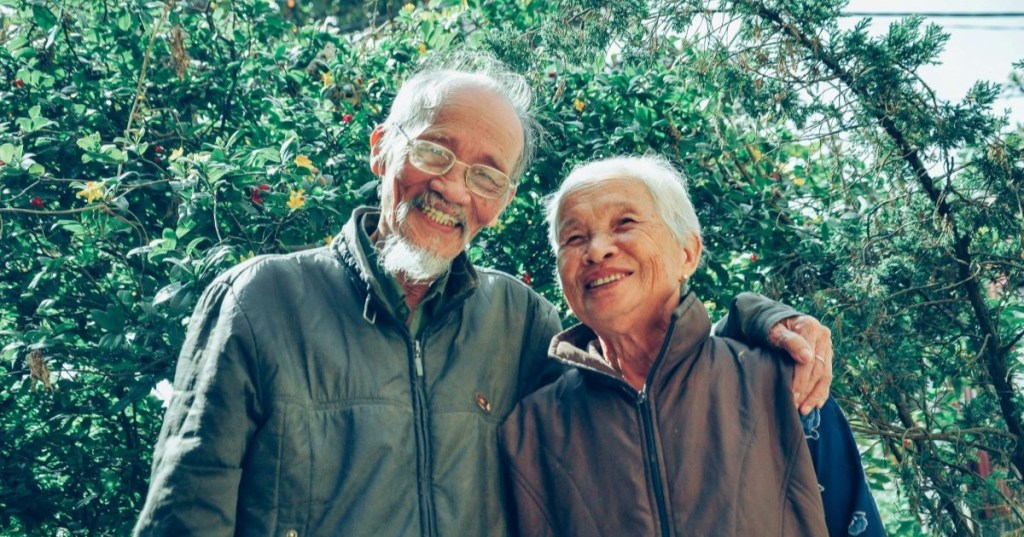 A smiling elderly couple