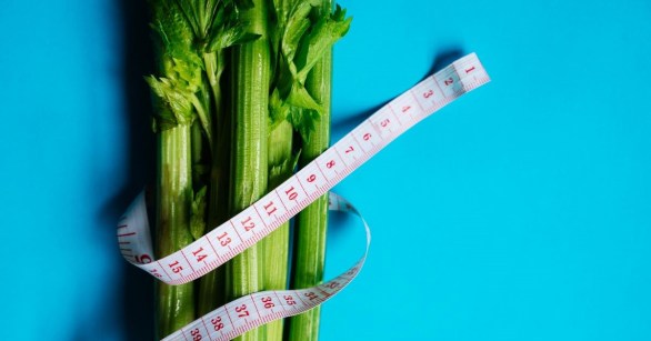 A tape measure wrapped around celery