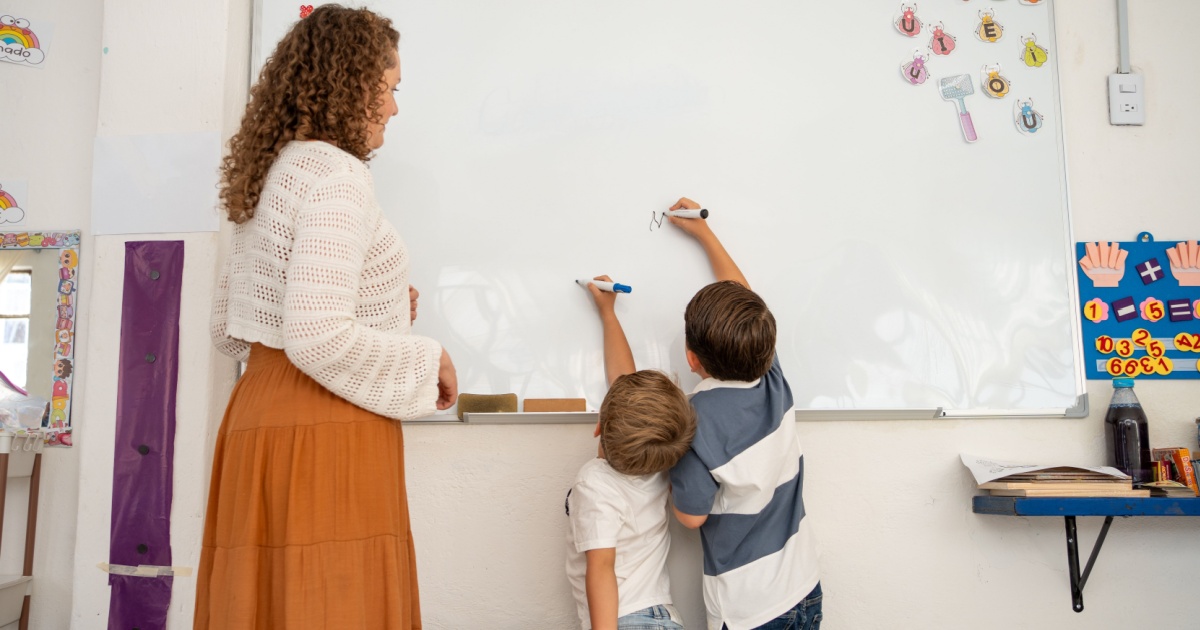 Kids of different height writing