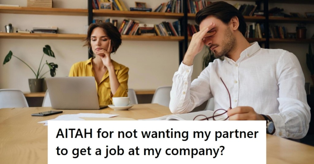 Tired man sharing desk with coworker