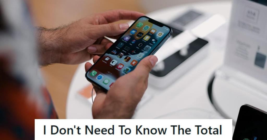 Man looking at a new phone he's about to buy