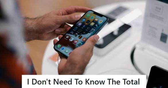 Man looking at a new phone he's about to buy