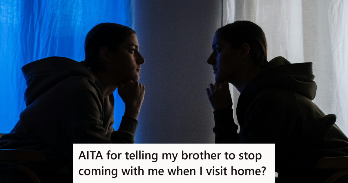 Two people sitting opposite each other in dim light