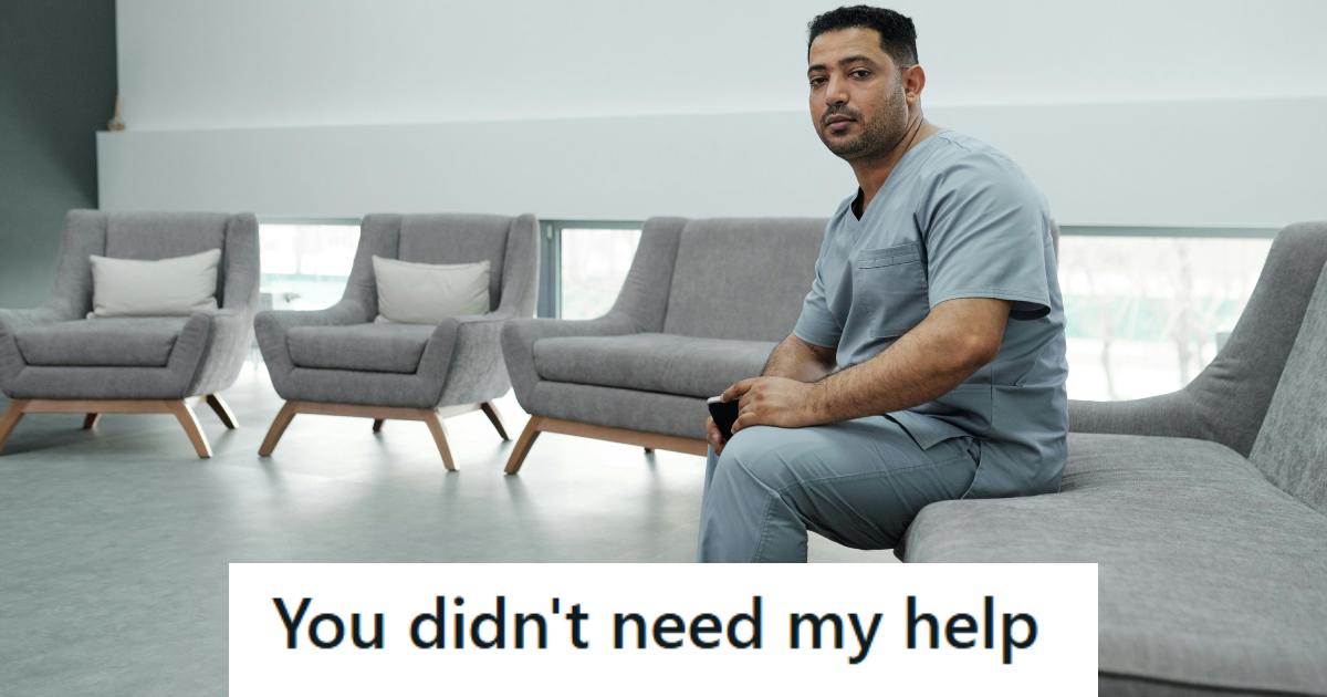 Male nurse sitting and watching everyone else struggle to move boxes