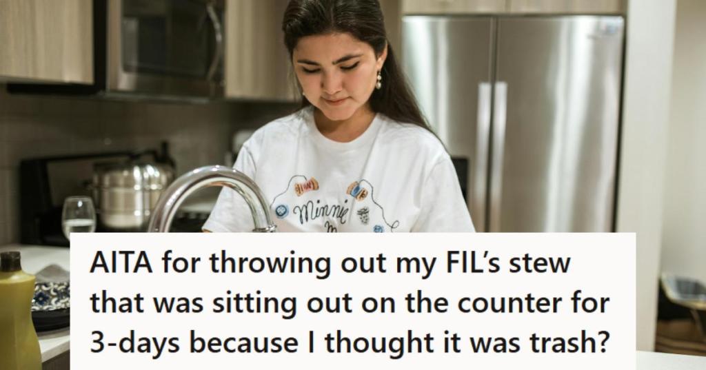 Woman washing dishes after cleaning up the kitchen