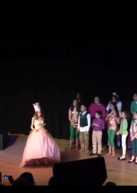 Children acting out Wicked