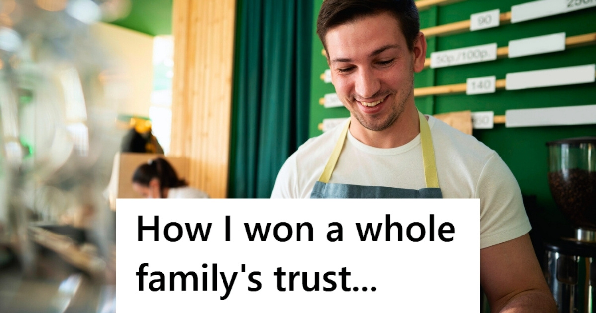 Male retail worker smiling