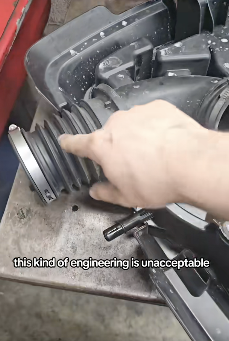 man pointing to an engine