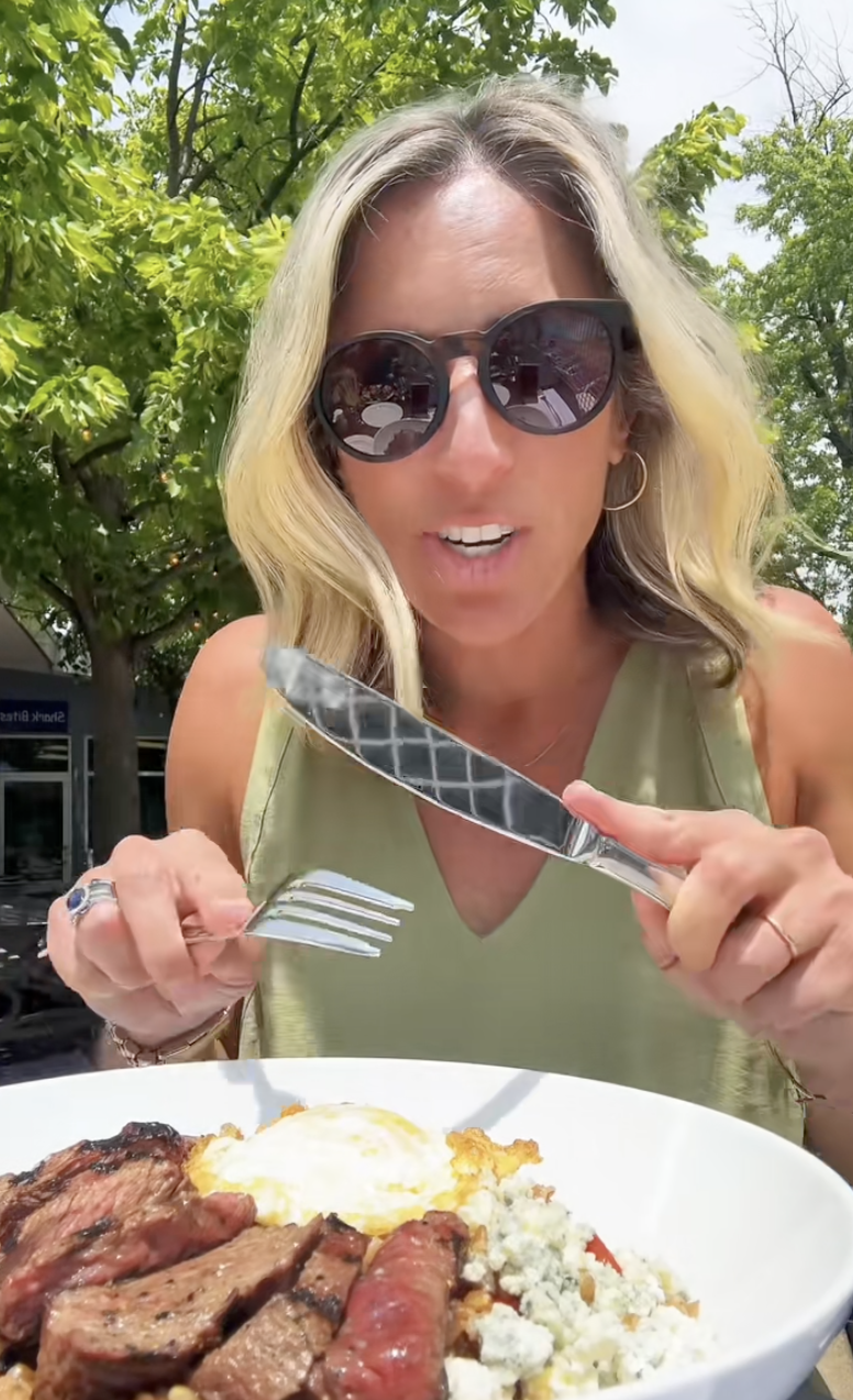 woman eating a plate of food