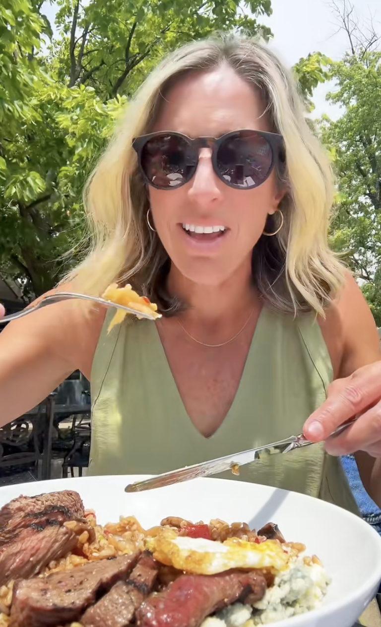 woman eating a plate of food