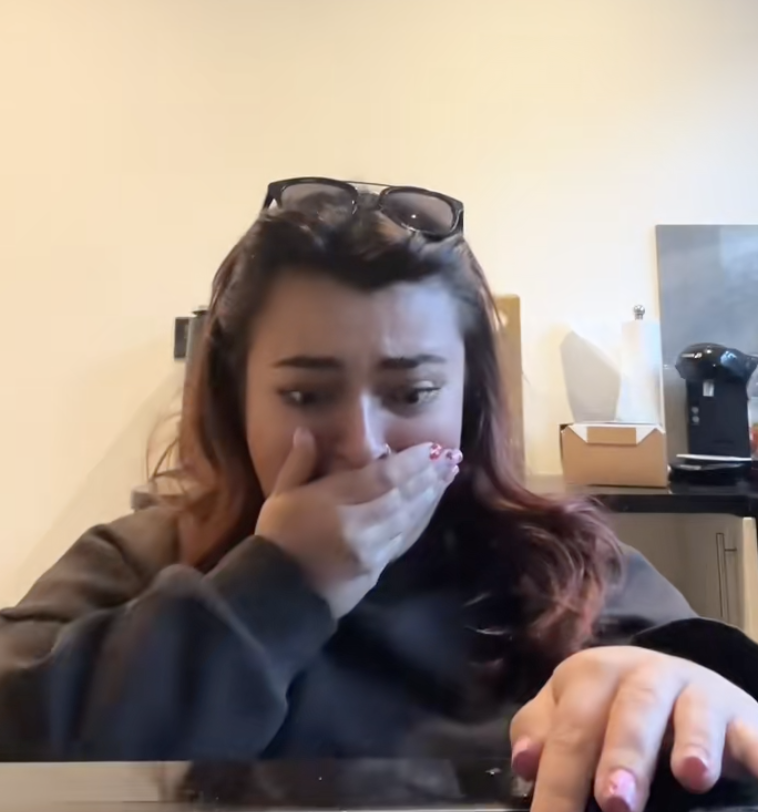 woman trying to figure out her oven