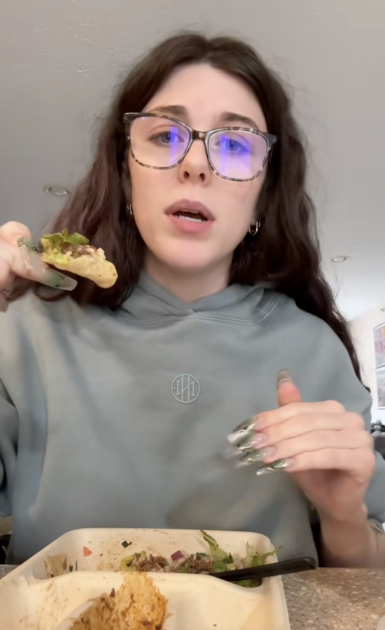 woman holding some nachos