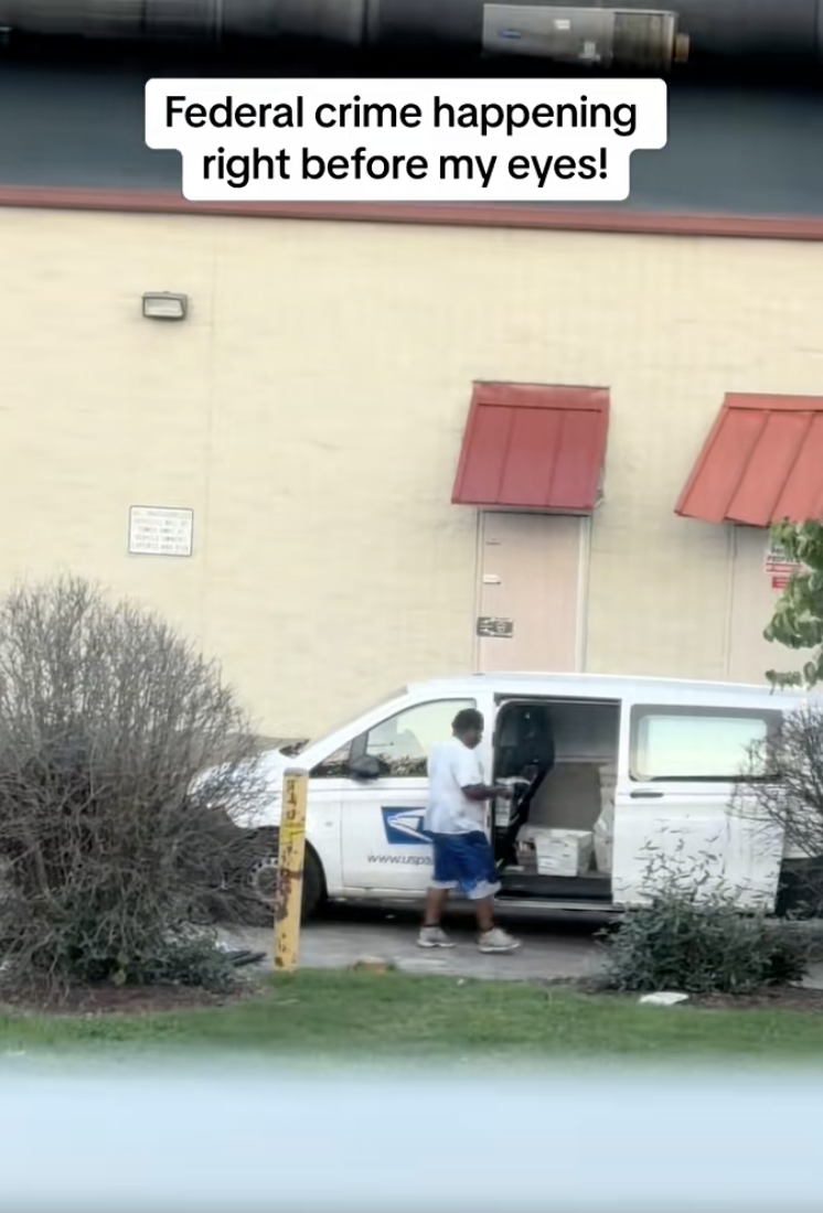 post office worker by a truck