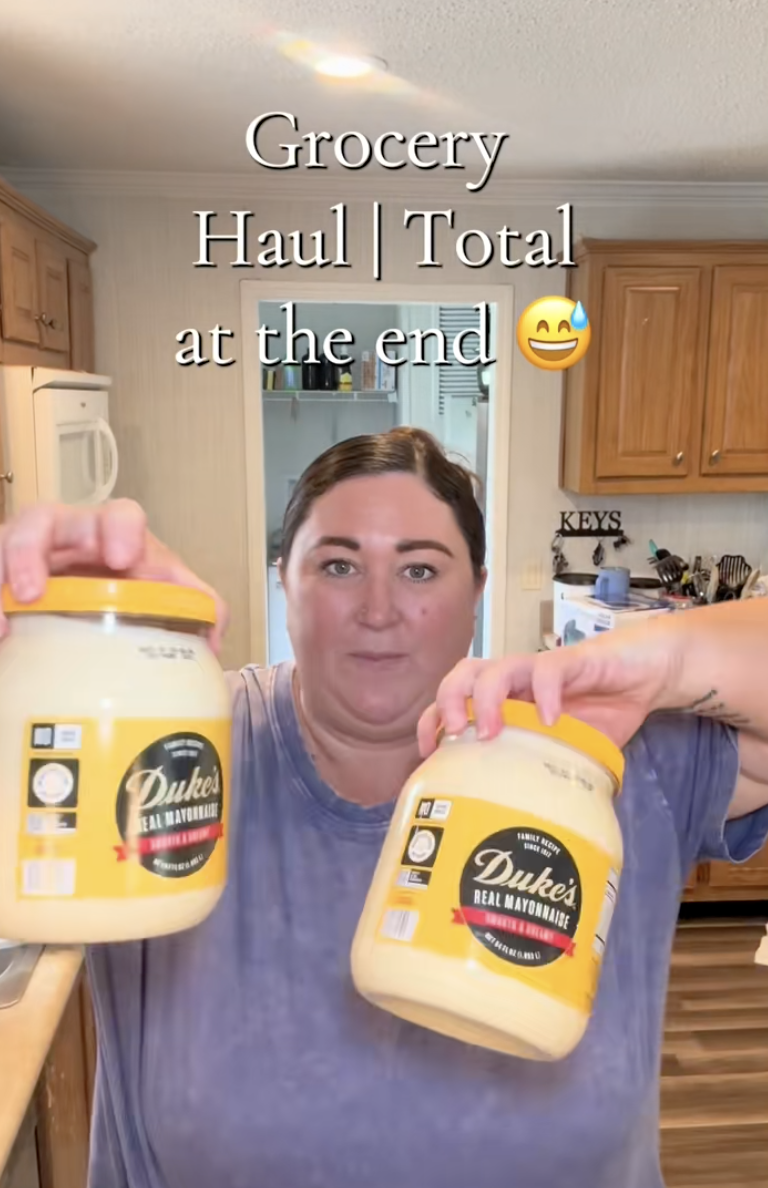 woman showing off her grocery haul