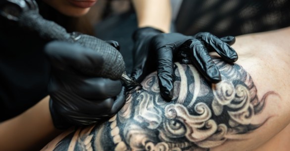 Tattoo artist working