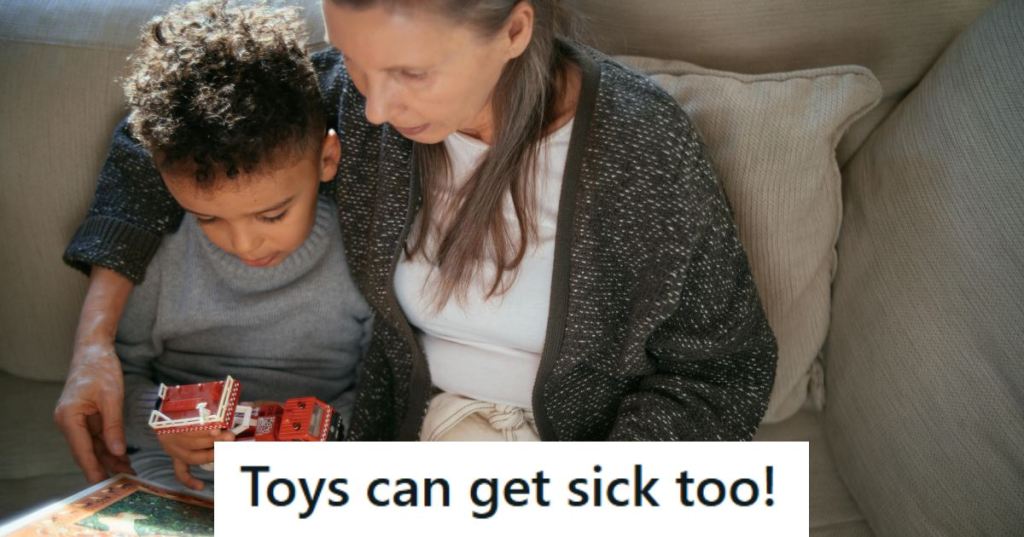Mom and little boy cuddling up on the couch, reading a book
