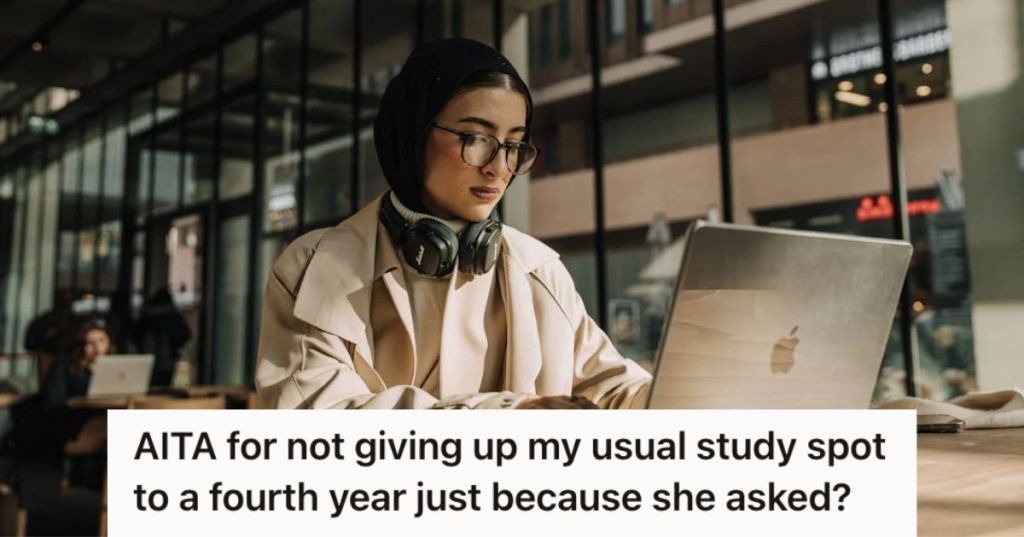 Woman using her computer in a coffee shop