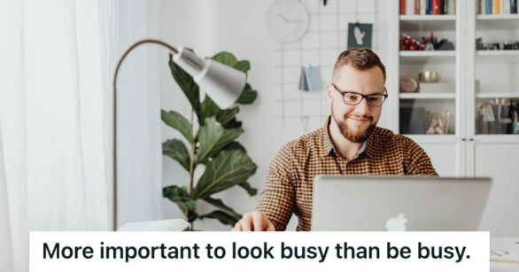 Man smiling while working on his computer