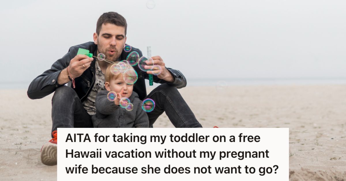 Man and toddler playing bubbles on the beach