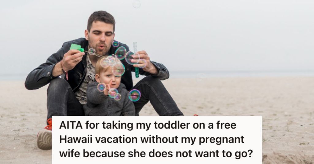 Man and toddler playing bubbles on the beach