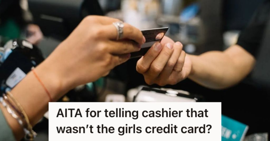 Person paying the cashier with their c redit card