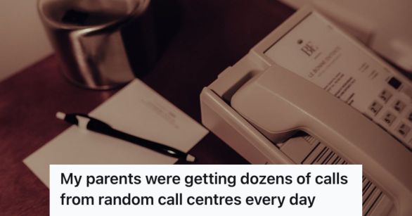 A landline phone on the table with a pen and notepad beside it