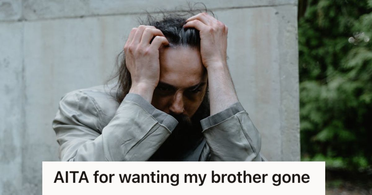 Distressed man holding his head with his hands