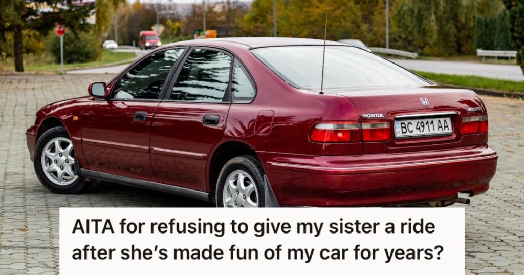 A maroon Honda car on the street