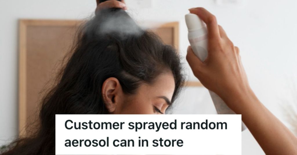 Woman spraying aerosol on her hair