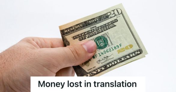 Person's hand holding out a 20 dollar bill