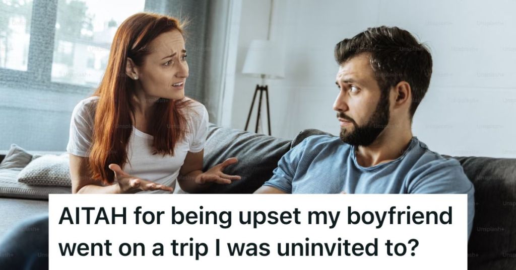 Upset woman sitting on a couch with a confused man