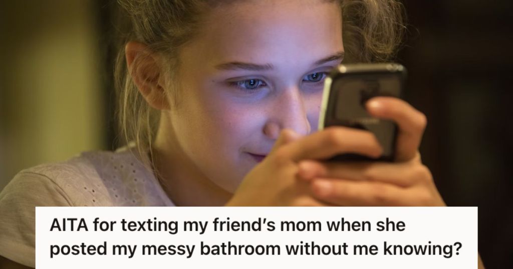 Smirking teen girl looking at her phone