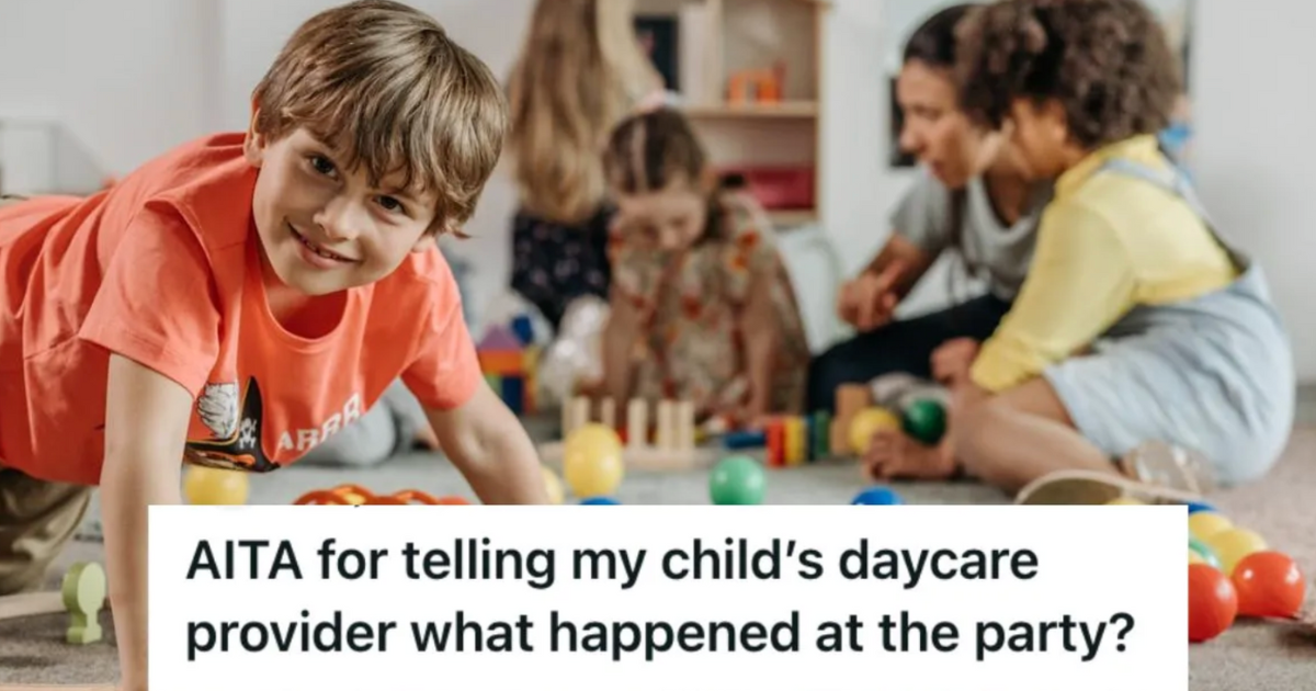 A little boy smiling while attending daycare with other kids