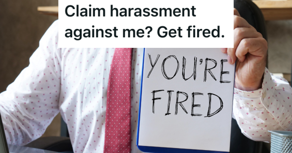 businessman holding up a piece of paper that reads "you're fired"