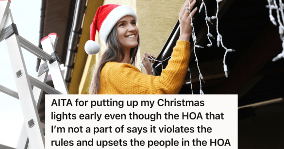 smiling woman in Santa hat hanging Christmas lights on her house