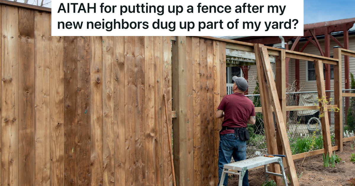 man building a tall wooden fence