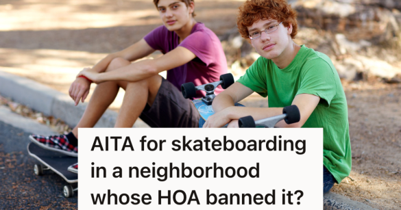 two teenage boys sitting on the curb with their skateboards