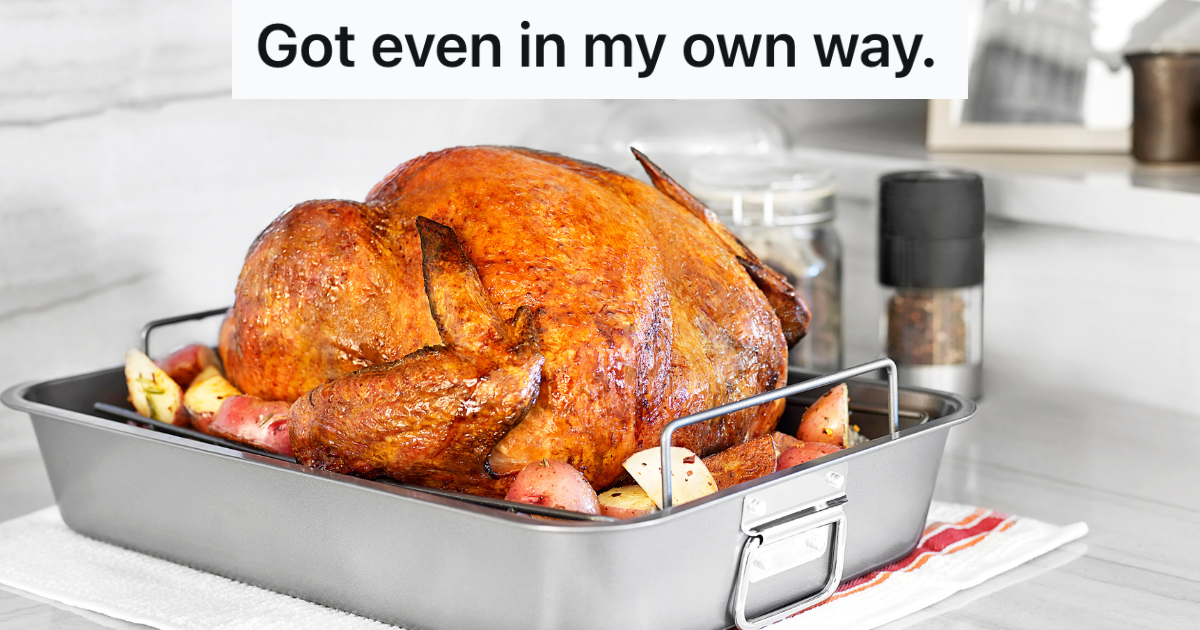 turkey in roasting pan on kitchen counter