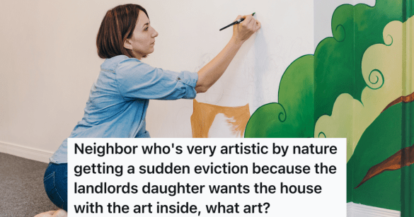 woman painting a mural on a wall