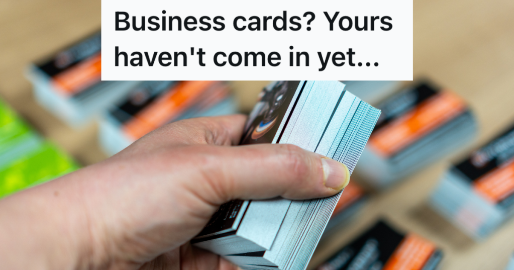 hand holding a stack of business cards