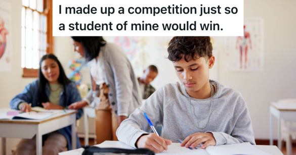 male student working on a writing assignment in class