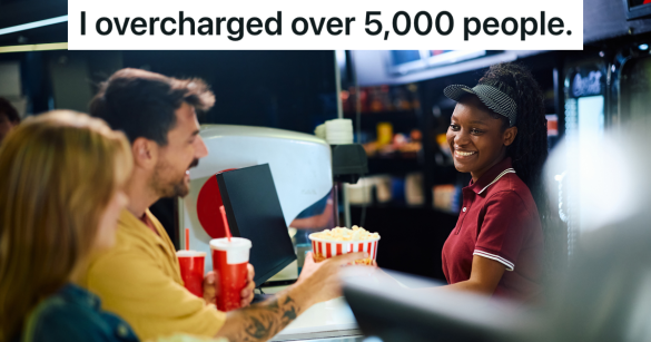 couple buying popcorn at concession stand